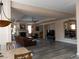 Spacious living room features a fireplace, dark floors and recessed ceilings with warm neutral paint throughout at 8070 Pavarotti Ave, Las Vegas, NV 89178