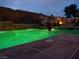 Backyard pool view with refreshing drink on tiled ledge at dusk at 8070 Pavarotti Ave, Las Vegas, NV 89178