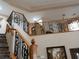 Stairway with decorative iron and wood railings leading to a large upstairs space at 8070 Pavarotti Ave, Las Vegas, NV 89178
