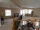 Open upstairs area with railings overlooking the lower level with carpet, windows and french doors at 8070 Pavarotti Ave, Las Vegas, NV 89178