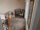 Upstairs landing featuring carpet, decorative iron railings, artwork, and furnishings at 8070 Pavarotti Ave, Las Vegas, NV 89178