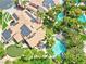 Drone's eye view of a home showcasing a pool, putting green, and solar panels at 8324 Slate Harbor Cir, Las Vegas, NV 89128