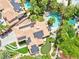 Aerial view of property featuring a pool, putting green, and solar panels at 8324 Slate Harbor Cir, Las Vegas, NV 89128