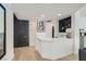 Stylish wet bar features white countertops, black accent wall, decorative lighting and a wine rack at 8324 Slate Harbor Cir, Las Vegas, NV 89128