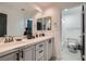Bright bathroom with double sinks, sleek countertops, and modern fixtures at 8324 Slate Harbor Cir, Las Vegas, NV 89128