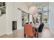 Dining area with modern light fixtures and views to the side yard at 8324 Slate Harbor Cir, Las Vegas, NV 89128