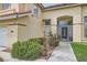 Charming two-story home with desert landscaping and an arched wrought-iron front gate at 8324 Slate Harbor Cir, Las Vegas, NV 89128