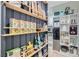 Organized pantry with shelving stocked with dry goods and small appliances at 8324 Slate Harbor Cir, Las Vegas, NV 89128