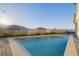 Beautiful backyard featuring a refreshing pool and lush greenery, creating a private oasis at 864 Firestone Ledge Ave, Henderson, NV 89012