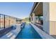 Charming backyard with a narrow pool, covered patio, and elegant details, perfect for entertaining at 864 Firestone Ledge Ave, Henderson, NV 89012