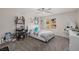 Bright bedroom featuring a comfortable bed, work station, and egg chair at 864 Firestone Ledge Ave, Henderson, NV 89012
