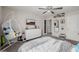 Bedroom featuring comfortable bed, mounted tv, and decorative egg chair at 864 Firestone Ledge Ave, Henderson, NV 89012
