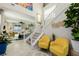 Bright foyer featuring a staircase and contemporary decor, leading to the living area at 864 Firestone Ledge Ave, Henderson, NV 89012