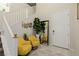 Inviting entryway featuring stylish decor, a staircase, and bright, natural light at 864 Firestone Ledge Ave, Henderson, NV 89012
