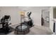 Bright exercise room featuring a stationary bike, trampoline, and elliptical machine at 864 Firestone Ledge Ave, Henderson, NV 89012