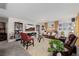 Inviting living room featuring plush seating, a large screen TV, and stylish decor at 864 Firestone Ledge Ave, Henderson, NV 89012