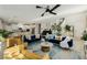 Open-concept living space with modern decor, connecting the living room and kitchen seamlessly at 864 Firestone Ledge Ave, Henderson, NV 89012