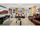 Living room offering ample seating, an entertainment center, and stylish window treatments at 864 Firestone Ledge Ave, Henderson, NV 89012