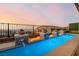 Inviting pool with water and fire features, perfect for relaxation and outdoor entertainment at 864 Firestone Ledge Ave, Henderson, NV 89012