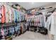 A spacious walk-in closet with extensive shelving, hanging racks, and storage space for clothes and shoes at 864 Firestone Ledge Ave, Henderson, NV 89012