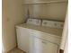Functional laundry area equipped with a standard, white washing machine and dryer at 8725 W Flamingo Rd # 226, Las Vegas, NV 89147