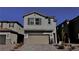 A charming two-story home featuring a two-car garage and beautiful, low-maintenance desert landscaping at 8974 Lucky Crest St, Las Vegas, NV 89113