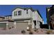 Charming two-story home with a two-car garage, stone accents, and desert landscaping at 8974 Lucky Crest St, Las Vegas, NV 89113