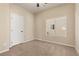 Cozy bedroom with neutral walls, carpet flooring, and a bright window at 9853 Russian Hill St, Las Vegas, NV 89141