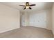 Bright bedroom with neutral carpet, a ceiling fan, and a closet at 9853 Russian Hill St, Las Vegas, NV 89141