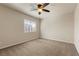 Bedroom with neutral carpet, a ceiling fan, and a window with blinds at 9853 Russian Hill St, Las Vegas, NV 89141