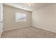 Bedroom with neutral carpet, a ceiling fan, and a window with blinds at 9853 Russian Hill St, Las Vegas, NV 89141