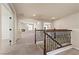 Open hallway with railings leading to various rooms in the house at 9853 Russian Hill St, Las Vegas, NV 89141