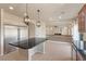 Spacious kitchen with a large island and stainless steel refrigerator at 9853 Russian Hill St, Las Vegas, NV 89141