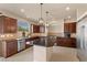 Modern kitchen features granite countertops, stainless steel appliances, and ample cabinet space at 9853 Russian Hill St, Las Vegas, NV 89141