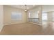 Open-concept living space with wood floors, neutral tones, and recessed lighting at 9853 Russian Hill St, Las Vegas, NV 89141