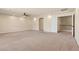 Expansive living room featuring neutral decor, a ceiling fan, and access to a second level at 9853 Russian Hill St, Las Vegas, NV 89141