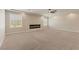 Expansive living room boasts recessed lighting, ceiling fan and a cozy modern fireplace at 9853 Russian Hill St, Las Vegas, NV 89141