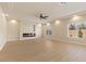 Spacious living room featuring a modern fireplace and ample natural light at 9853 Russian Hill St, Las Vegas, NV 89141