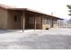 View of covered back patio and large backyard with gravel landscaping at 1081 Pluto St, Pahrump, NV 89048