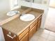 Bathroom features vanity with white sink, and a large mirror at 1081 Pluto St, Pahrump, NV 89048