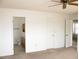 Bedroom showing doorway to bathroom, closet, and adjacent room at 1081 Pluto St, Pahrump, NV 89048
