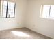 Bedroom features carpet and two windows at 1081 Pluto St, Pahrump, NV 89048