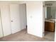 Bedroom features view into the bathroom at 1081 Pluto St, Pahrump, NV 89048