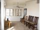 Bright bonus room filled with natural light, featuring a wooden desk and seating space in the room at 1081 Pluto St, Pahrump, NV 89048
