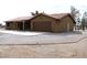 Charming single-story home featuring a tile roof, two-car garage, and desert landscaping at 1081 Pluto St, Pahrump, NV 89048