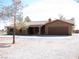 Welcoming single-story residence boasting desert landscaping and a convenient two-car garage at 1081 Pluto St, Pahrump, NV 89048