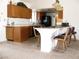 Spacious kitchen with oak cabinets, tile floors, and breakfast bar seating at 1081 Pluto St, Pahrump, NV 89048
