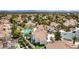 Aerial view of a community, showing lush landscaping, pools, and well maintained properties at 1600 Windsford Cir, Las Vegas, NV 89117