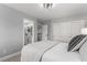 Comfortable bedroom with a view to the bathroom, and sliding closet doors at 1600 Windsford Cir, Las Vegas, NV 89117