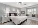 Relaxing bedroom featuring custom window seating, stylish decor, and patterned wallpaper at 1600 Windsford Cir, Las Vegas, NV 89117